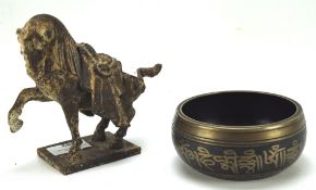 A Tibetan bronze bowl and a Chinese style tang horse, the bowls interior depicting Buddha,