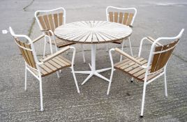 A set of garden furniture, comprising four teak and metal mounted chairs and matching table,