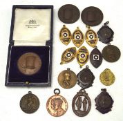 A small collection of medallions, including Gloucestshire association of MRC,