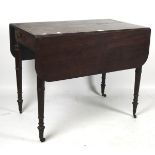 A late 19th century mahogany pembroke table, raised upon turned supports,