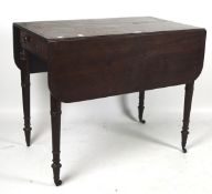 A late 19th century mahogany pembroke table, raised upon turned supports,