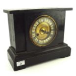 A late 19th century black painted mantle clock, the enamel dial with Roman numerals denoting hours,