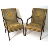 A pair of 1960s/70s mahogany bedroom chairs, with reeded scrolled arms and 1920s style upholstery,