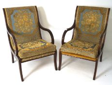 A pair of 1960s/70s mahogany bedroom chairs, with reeded scrolled arms and 1920s style upholstery,