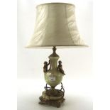 A gilt metal and stone table lamp, with two Cherubs adorning the central section,