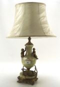 A gilt metal and stone table lamp, with two Cherubs adorning the central section,