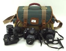 Assortemnt of Cannon cameras and accessories including an EOS 350 digital and lenses