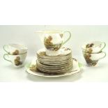 A Shelley 'Heather' pattern part tea set, comprising tea cups.