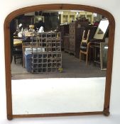 A pine framed over mantle wall mirror,