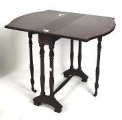 A late 19th/early 20th century mahogany suntherland table, with inlaid details,