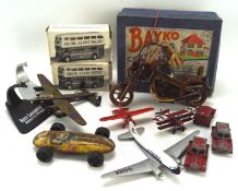 A collection of toys, including model planes, a boxed Bayko Building Set,