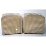 A pair of square stools, upholstered in beige reeded velvet fabric,