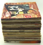 A collection of assorted vinyl records and LP's, including The Beatles, film themesongs and more,