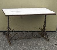 A heavy cast iron table, of rectangular form, with stone slab to top,
