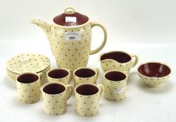 A Susie Cooper part coffee service, including six cups and saucers, a milk jug,
