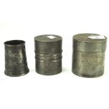 Two Chinese pewter tea caddies and a pewter cup, one tea caddy with interior lid,