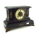 A late 19th/early 20th century black painted mantle clock by the Ansonia clock company,