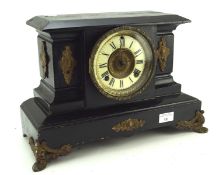 A late 19th/early 20th century black painted mantle clock by the Ansonia clock company,