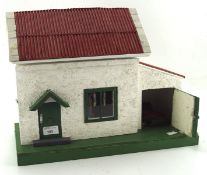 A small vintage dolls house, with partially fitted interior,