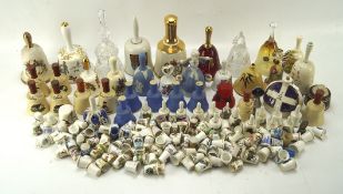 A collection of ceramic and pottery thimbles and bell ornaments,