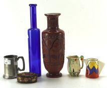A collection of assorted ceramics and other wares, including a Wedgwood Clarice Cliff pouring jug,