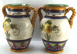 A pair of large continental glazed ceramic vases,