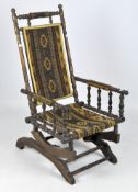 A late 19th/early 20th century turned wooden rocking chair,