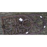 Two cast metal plant pot holders, of arched form with pierced decoration,