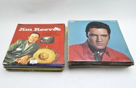 A collection of vintage pop & rock music records, including: Jim Reeves, Russ Conway,