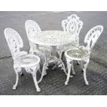 A group of vintage white painted aluminum garden furniture, including a table and four chairs,