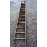 A large vintage wooden ladder,