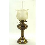 An early 20th century brass oil lamp, with moulded glass shade and clear glass funnel,