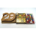 A collection of contemporary casino counters and a cribbage board,