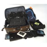 A collection of suitcases and handbags, including an Armani black leather bag,