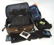 A collection of suitcases and handbags, including an Armani black leather bag,