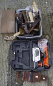 A collection of assorted tools, to include a workbench vice,