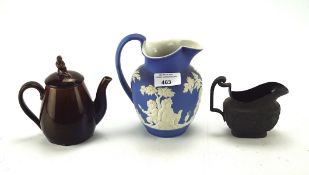 Three pieces of Wedgwood ceramics, to include a Jasperware blue and white pouring vessel,