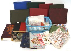 A box of assorted unused stamp albums and an assortment of British and World stamps,