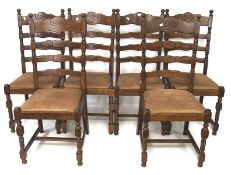 Six 20th century oak ladderback country dining chairs, the oak frames with carved details,