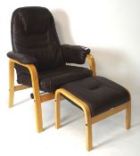 A contemporary stressless style armchair with matching footstool,