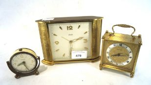 Three vintage clocks, one being a Swiza Mignon 8 day,