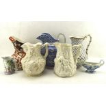 A selection of five ceramc pouring jugs and more, to include one 19th century example,