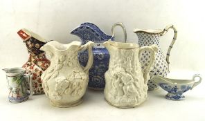 A selection of five ceramc pouring jugs and more, to include one 19th century example,