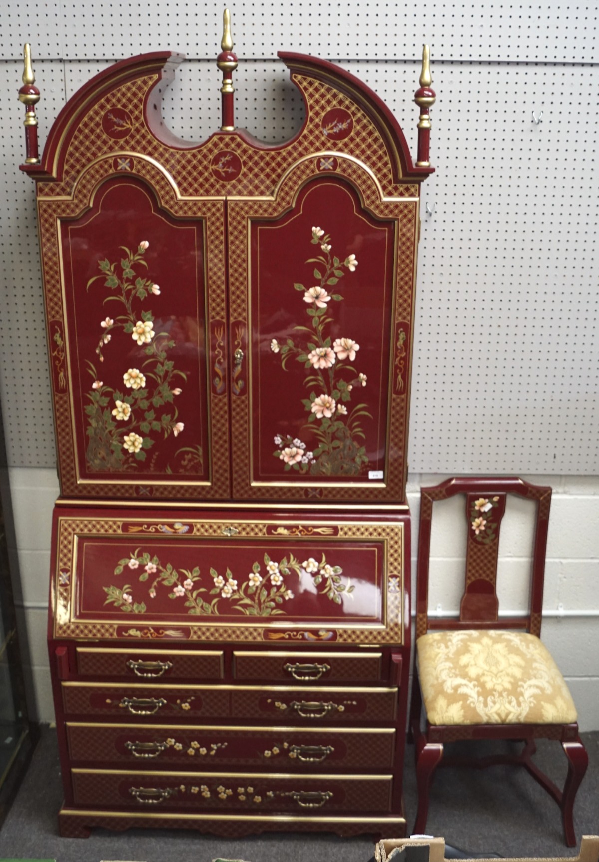 Large red cabinet bureau and matching chair with flowers and gold details,