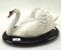 A Franklin Mint bisque model of 'The Royal Swan' on an oval base,