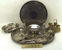 A collection of silver plated items including two galleried trays, brushes, dishes,