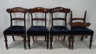 A set of four Victorian mahogany chairs, each with turned front supports and upholstered seats,