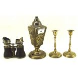 A pair of 20th century Indian brass candle sticks together with a pair of opera glasses and another