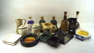 An assortment of advertising pub memorabilia including water jugs, ashtrays, Bell Decanters.