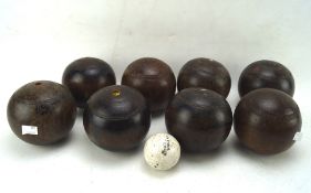 A number of vintage bowling balls and a jack